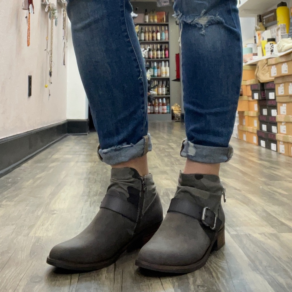 Ankle booties with a buckle and camo detailing
